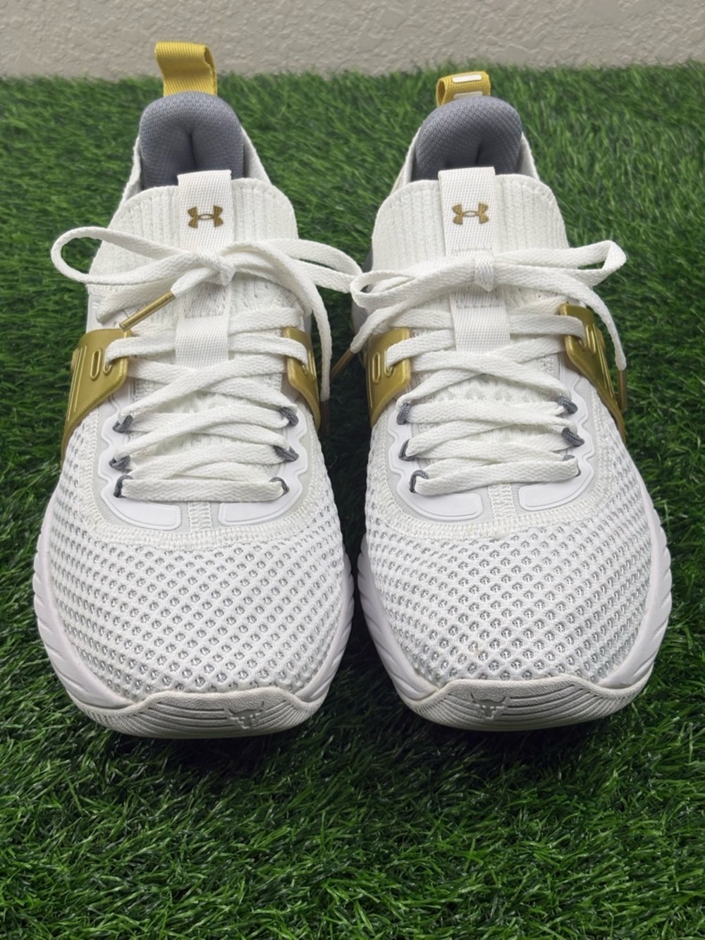 Under Armour Women’s HOVR Project Rock 4 Training Sneakers in White and Gold